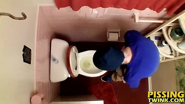 Devin Reynolds grabs his cock and unloads in the toilet|