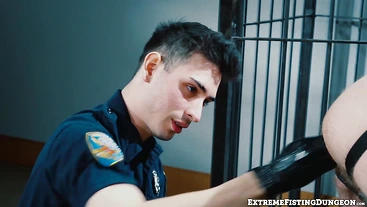 Dirty cop Luka Sage fists prisoner Josh Mikael on the precinct desk