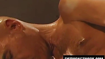 Pierced Simon Cox gets ass fisted open by Xavier Vitale