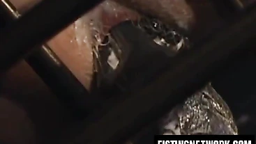 Eric Evan fists long dick Jerek through steel bars