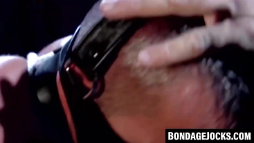 Tattooed wrestler bound and dominated by a fierce opponent