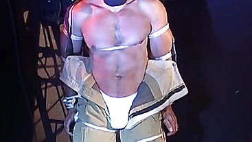 Muscular man bound tight waiting for torment from the captor