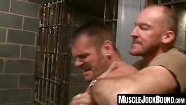 MuscleJockBound.com - Sadist Paul Stag strokes and cums on captives