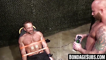 Hairy european soldier Dirk Caber screams with pleasure while being tied up and electro stimulated